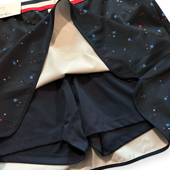 LADY HAGEN | Women's Contrast Trim Golf
Skort in Red and Blue Stars Print - Picture 5 of 7